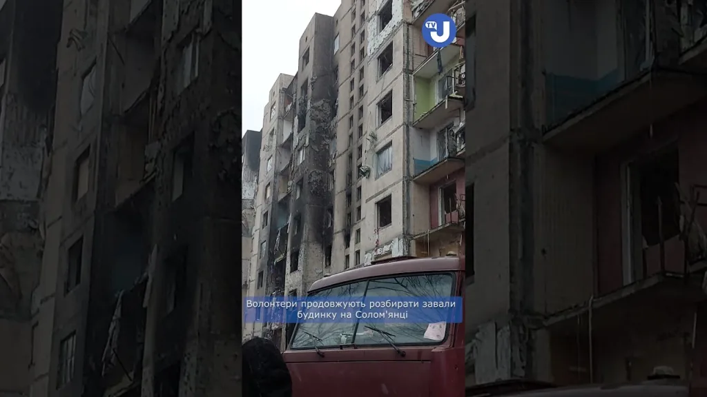 Volunteers continue to dismantle the rubble of the house on Solomyanka