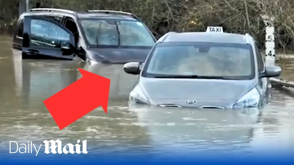 Driver and passengers rescued after taxi submerged in floodwater during New Year’s Eve storm chaos